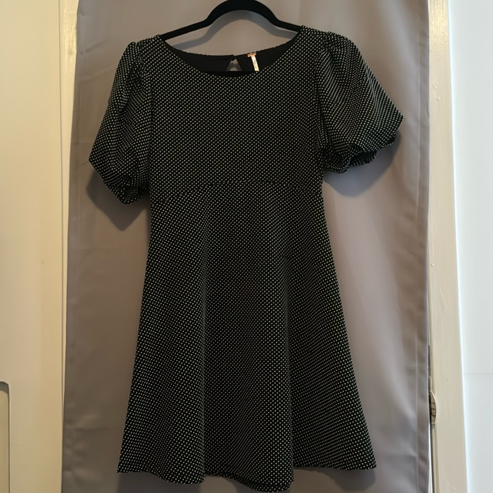 Black polka dotted scoop neck dress.